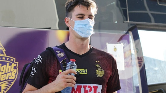 Aussie quick Pat Cummins wears a mask while arriving at an IPL game.