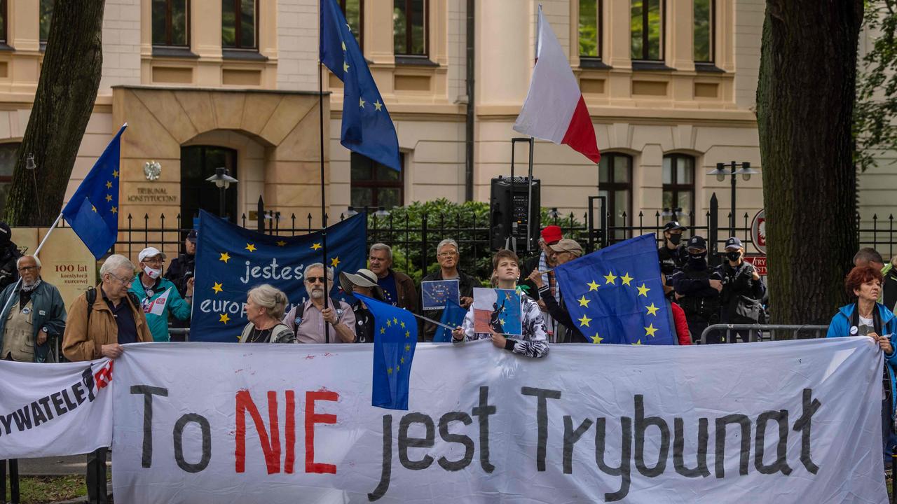 Pro European demonstrators holding a banner reading "This is not a Constitutional Court" as they protest in front of the constitutional court in Warsaw. (Photo by Wojtek RADWANSKI / AFP)