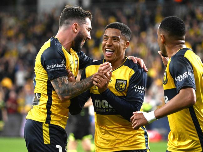 Sammy Silvera (centre) celebrates scoring for the Mariners in last season’s A-League grand final. Picture: Saeed Khan / AFP