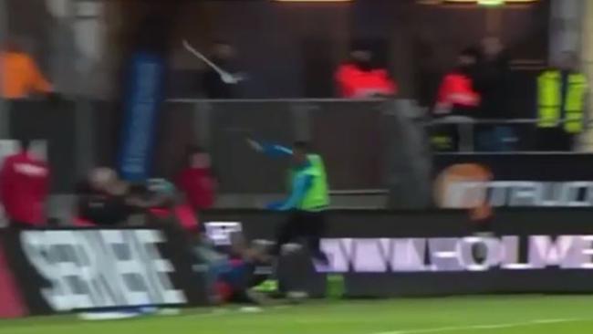 Video: Football player throws corner flag at crowd