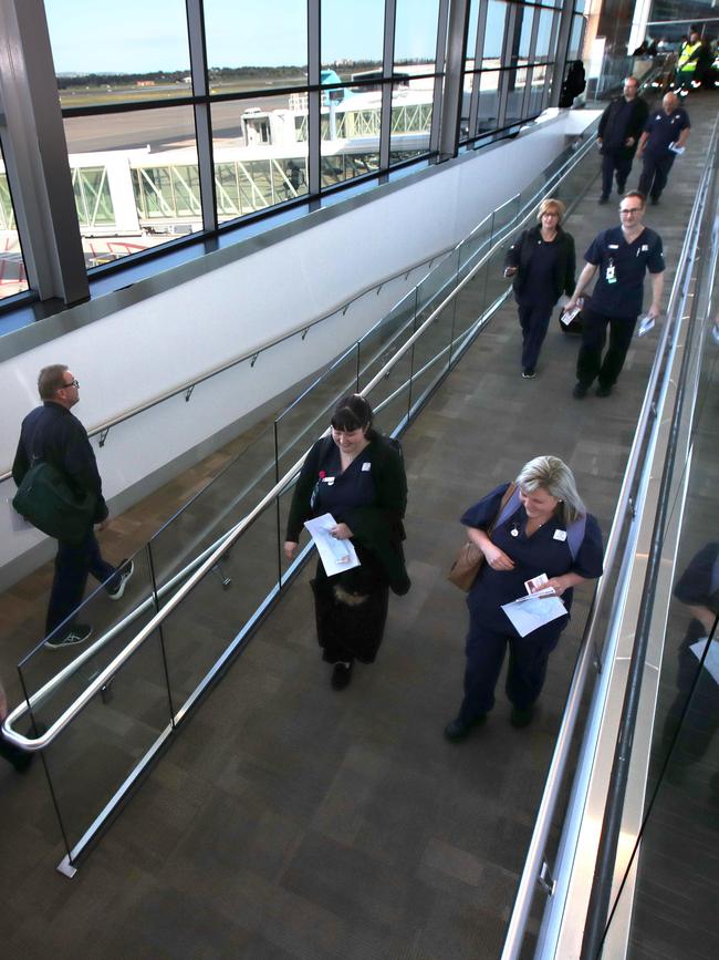 South Australian nurses and paramedics a board a Qantas flight after answering an “urgent request” from Victoria. Picture: NewsWire/Kelly Barnes