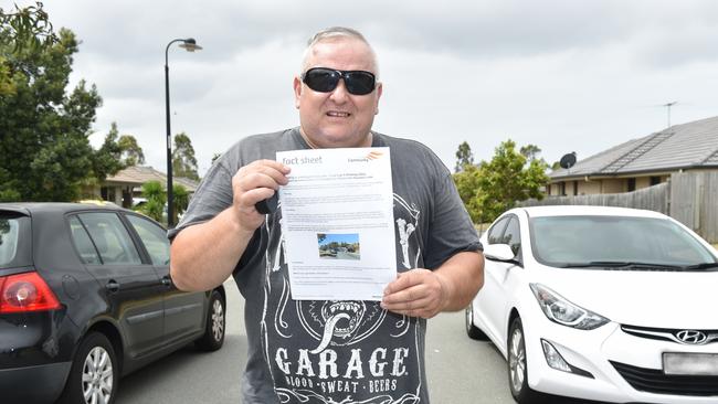 Steven Lovli with a council letter warning against illegal parking at his Denham Crescent property in North Lakes. Picture: Marcel Baum