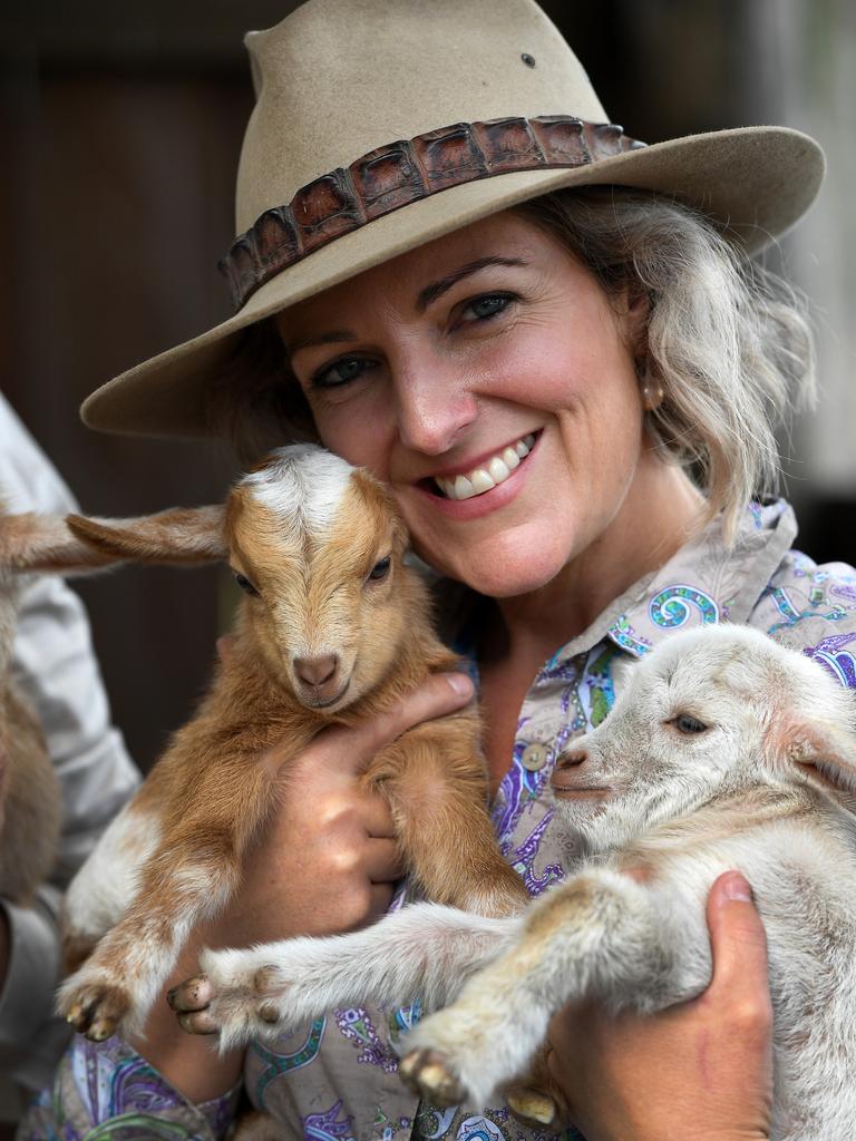 Carly Clark with two baby goats at Splitters Farm.