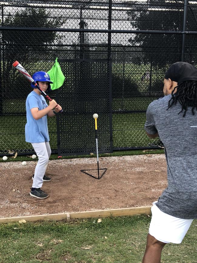 US major league baseball great manny Ramirez passes on tips to junior players on the northern beaches at a special training hosted by Pittwater Baseball Club at North Narrabeen Reserve on Wednesday night. Picture: Jim O'Rourke