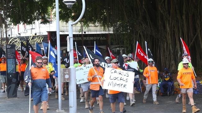 CFMEU, ETU and MWU members march down Lake St in the Cairns CBD en route to the offices of construction company John Holland. Picture: Peter Carruthers