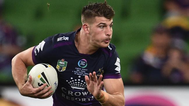 Melbourne Storm player Curtis Scott runs withe ball against the Gold Coast Titans during round two of the NRL at AAMI Park in Melbourne, Sunday, March 13, 2016. (AAP Image/Julian Smith) NO ARCHIVING, EDITORIAL USE ONLY