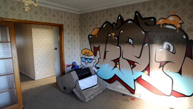 Graffiti in Herrmann’s derelict Bundoora home. Picture: Andrew Henshaw