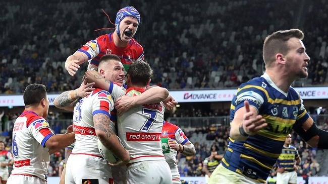 Newcastle players celebrate a Shaun Kenny-Dowall try. Picture: Phil Hillyard