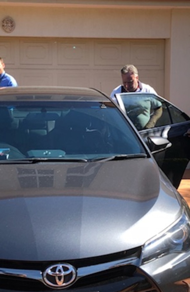 Andrew Eustice being taken away by detectives from his Buccaneer CRT home.