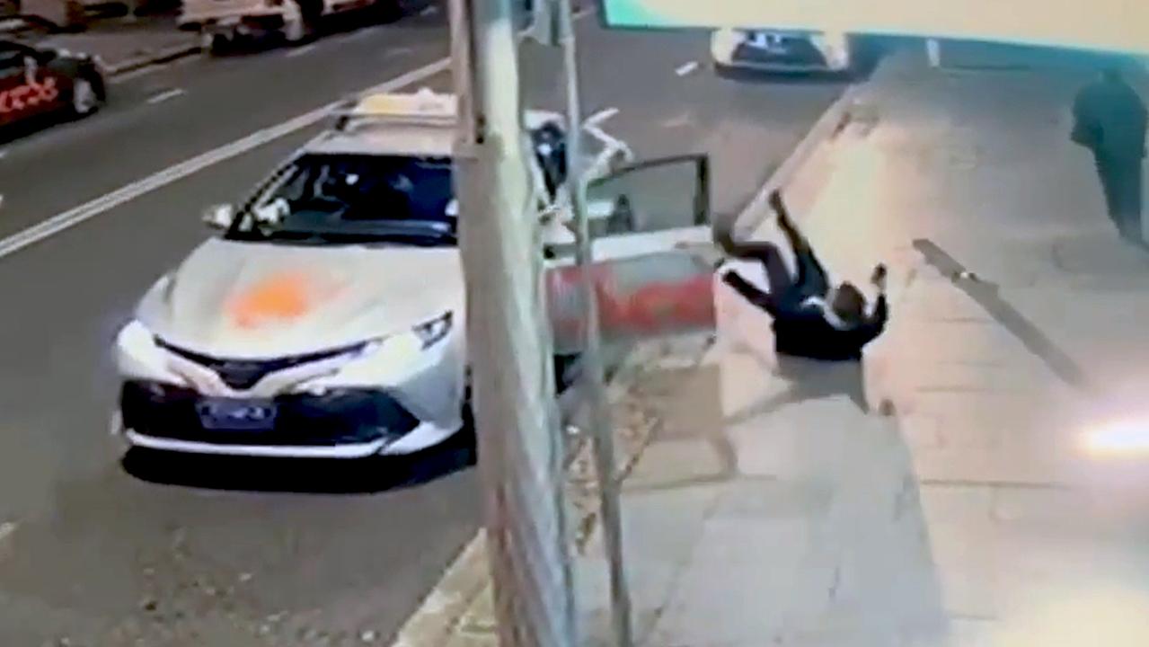 CCTV footage shows Henson falling over onto his back after the taxi’s door handle broke. Picture: NCA NewsWire