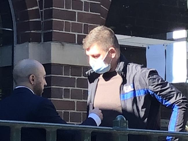 Filip Maslanka (right) taking to his solicitor Mark Kyrakos outside Manly Local Court on Wednesday after being sentenced for high range drink driving. Picture: Jim O'Rourke