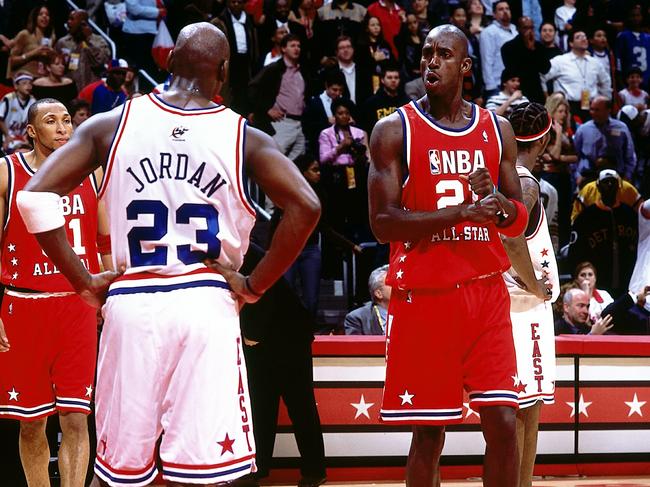 Kevin Garnett talks with Michael Jordan during the 2003 NBA All-Star Game. (Photo by Andrew D. Bernstein/NBAE via Getty Images)