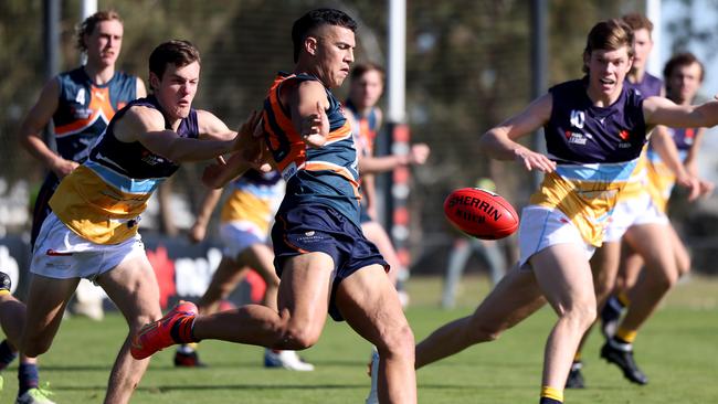 Sam Paea gets his kick away for Calder Cannons.
