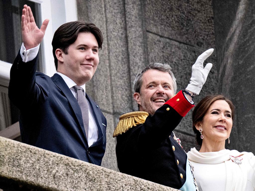 (L-R) Crown Prince Christian, King Frederik X of Denmark and Queen Mary of Denmark wave to the crowd after the a declaration of the King's accession to the throne. Picture: AFP / Denmark OUT