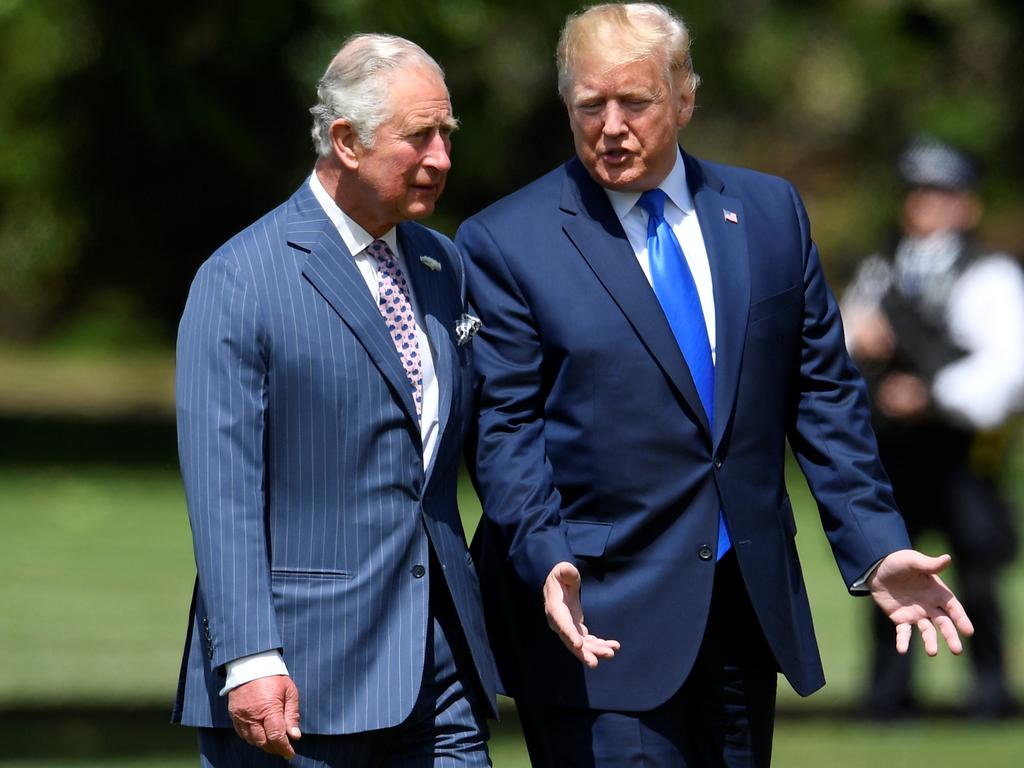 The President and Prince of Wales walk through the palace gardens ahead of the ceremonial welcome. Picture: Toby Melville / Pool / AFP