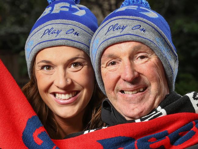 Neale Daniher is urging Victorian's to get behind this year's FightMND Big Freeze. The slide will again be at the MCG this year, while the game between Melbourne and Collingwood will be played in Sydney. Neale Daniher with daughter Bec Daniher with Melbourne and Collingwood scarves for the FightMND Big Freeze game.                       Picture: David Caird