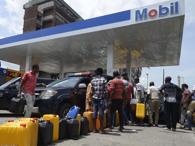 People queue to buy fuel in Nigeria on May 21 following a row over subsidy payment to petrol importers as well as sale of government oil blocks to private investors. Picture: Pius Utomi Ekpei / AFP