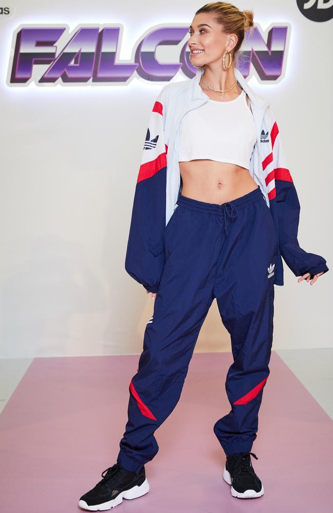 Hailey Baldwin teamed her Falcons with a tracksuit and crop top. Picture: Getty Images for adidas