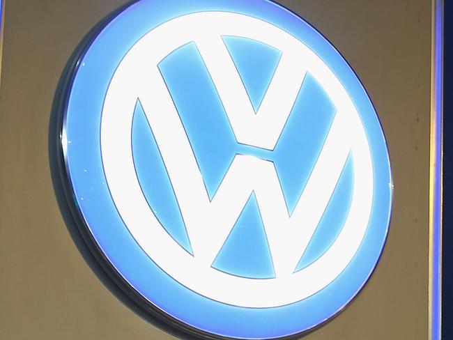 (FILE PHOTO) Volkswagen is expected to offer cash to around 500,000 owners of VW and Audi diesel cars equipped with illegal software in the United States in the coming week. WOLFSBURG, GERMANY - OCTOBER 21: A car departs from an entrance gate at the Volkswagen factory and company headquarters on October 21, 2015 in Wolfsburg, Germany. According to media reports a Volkswagen spokesman has acknowledged that the emissions cheating software the company installed in its EA 189 diesel motor in 11 million cars and light trucks worldwide might also be present in another diesel motor called the EA 228. The software the company deliberately installed manipulates diesel engine emissions results under testing conditions. Volkswagen faces investigations and fines in countries across the globe. (Photo by Sean Gallup/Getty Images)