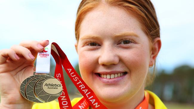 Australian hammer throwing champion Alex Hulley with her Australian gold medal. Pictures: Angelo Velardo