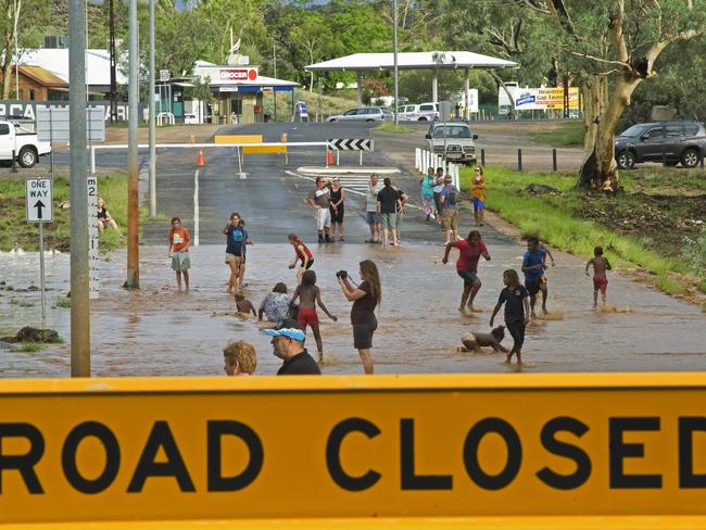 Locals swim at the Ross Highway causeway. PHOTO: Barry Skipsey