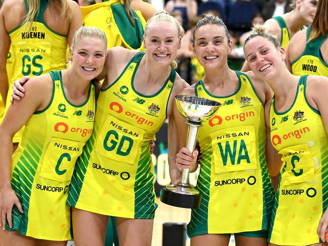 GOLD COAST, AUSTRALIA - OCTOBER 23: (L-R) Courtney Bruce, Jo Weston, Liz Watson, and Jamie-Lee Price of Australia pose for a photo with the Constellation Cup as they celebrate victory after the Constellation Cup match between the Australia Diamonds and New Zealand Silver Ferns at Gold Coast Convention and Exhibition Centre on October 23, 2022 in Gold Coast, Australia. (Photo by Bradley Kanaris/Getty Images)