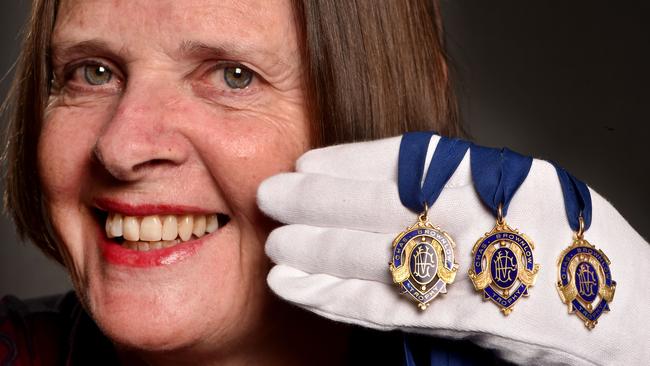 Suzie Horman with her father, Dick Reynolds’, Brownlow Medals. Picture: Jay Town