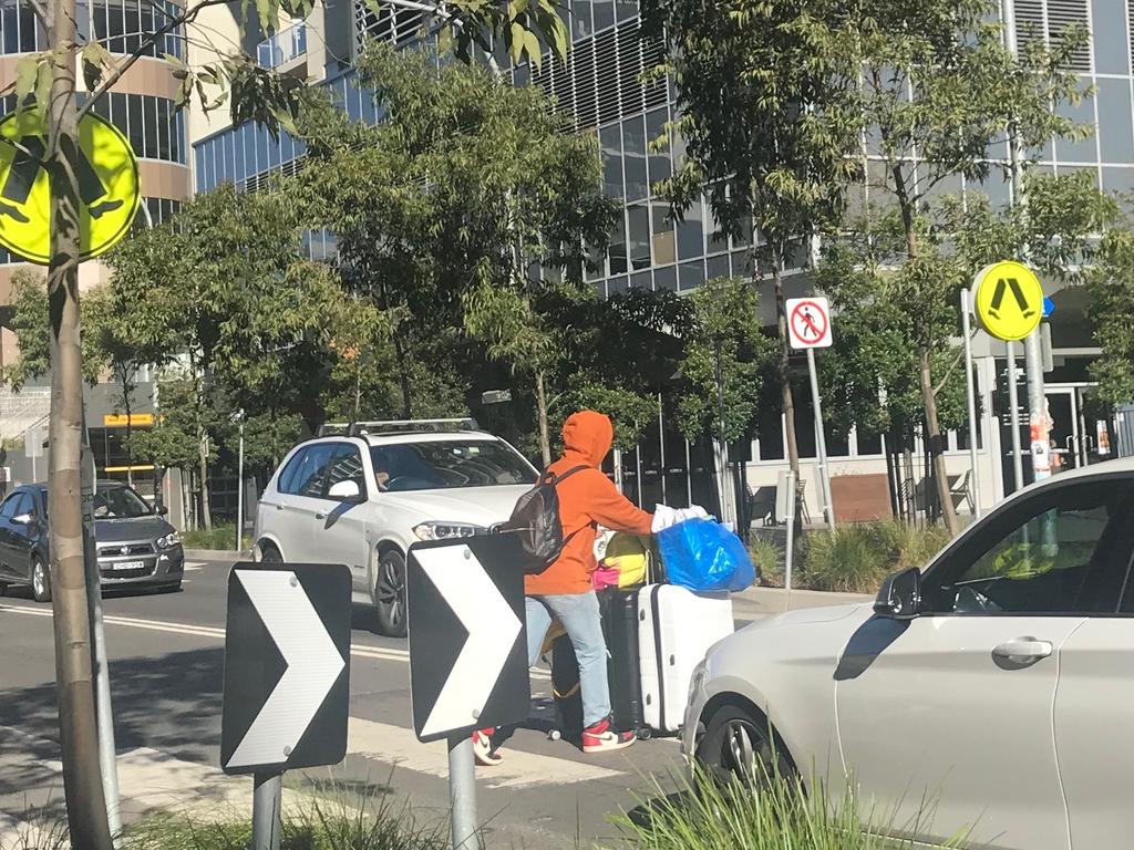 Residents could be seen carrying suitcases of belongings out into the streets. Picture: Supplied.