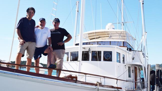 Rob Siganto (left) with former Olympic sailor Ron Jenyns and skipper Ashley Matthews on board the South Pacific II. Mr Siganto is one of the co-owners of Camp Island Lodge in the Whitsundays. Photo Charlotte Lam / Whitsunday Times