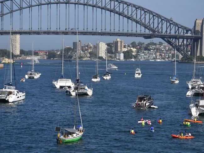 People on Canoes and Yachts gather at Farm Cove in preparation for New Years Eve Fireworks in Sydney, Monday, December 31, 2018. Picture: AAP / Brendan Esposito