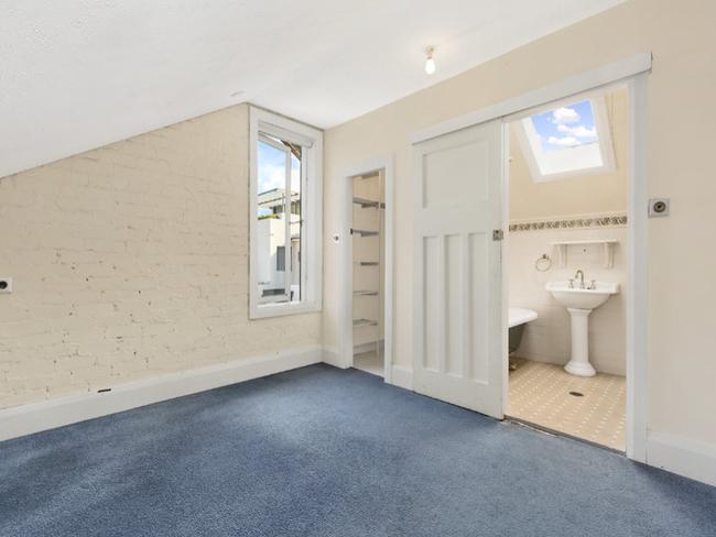 The upstairs bedroom has a bathroom and skylight - and the home was just 100m from Manly Beach.