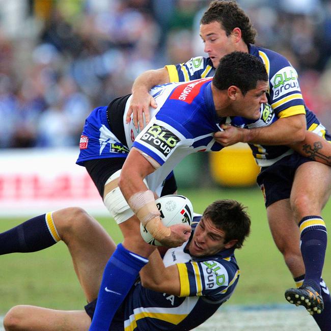 Bulldogs Willie Mason tackled by bottom and top Aaron Payne: NRL Rugby League Round 15 Sydney Bulldogs v North Queensland Cowboys at Gold Coast Stadium, Sunday June 18th, 2006. Digital image by Colin Whelan Action Photographics Picture: SUPPLIED