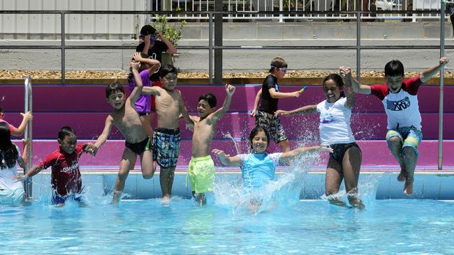 (L-R) Jai Satuala, 6, Jean-Paul Kawtal, 6, Joeroy Kawtal, 7, Jordan Kawtal, 7, Alanah Kawtal, 10, Jade Satuala, 10 and Joshua Kawtal, 12. People escaping the heatwave at Waves Fitness and Aquatic Centre, Baulkham Hills.