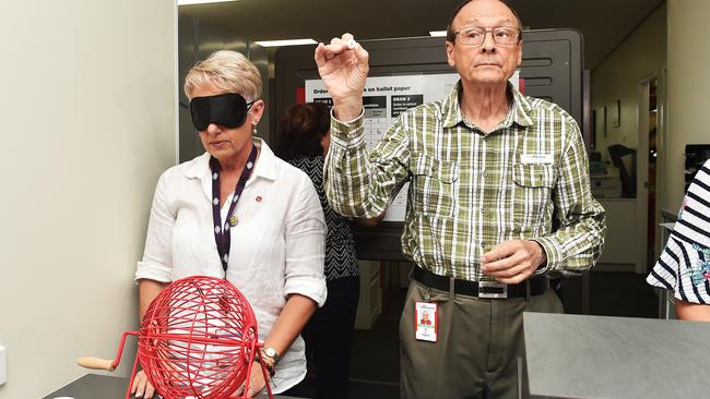 The AEC ballot draw is still done the traditional way. Kristine Church and Pat Higgins from the Australian Electoral Commission conduct the ballot draw in Herbert. Picture: Zak Simmonds