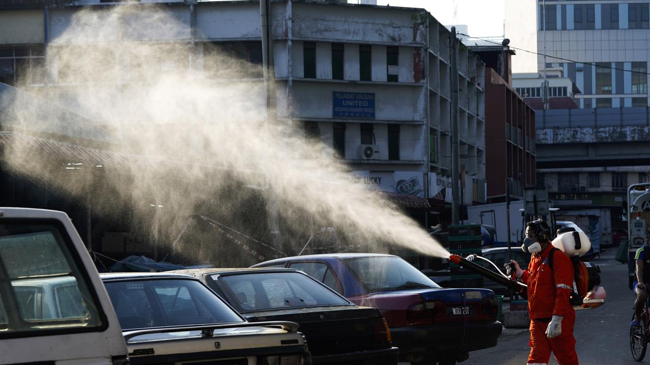 Disinfectant is sprayed at a market in Kuala Lumpur, Malaysia on April 1, 2020. Picture: Vincent Thian/AP