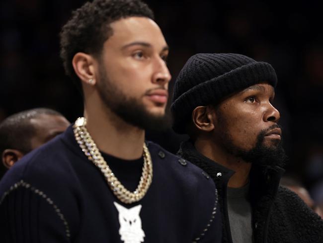 NEW YORK, NEW YORK - FEBRUARY 24: Kevin Durant #7 of the Brooklyn Nets looks on from the bench next to Ben Simmons #10 of the Brooklyn Nets against the Boston Celtics during the first half at Barclays Center on February 24, 2022 in New York City. NOTE TO USER: User expressly acknowledges and agrees that, by downloading and or using this Photograph, user is consenting to the terms and conditions of the Getty Images License Agreement.   Adam Hunger/Getty Images/AFP == FOR NEWSPAPERS, INTERNET, TELCOS & TELEVISION USE ONLY ==