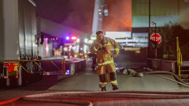 A firefighter on the scene at Thackeray St. Picture: Dean Asher