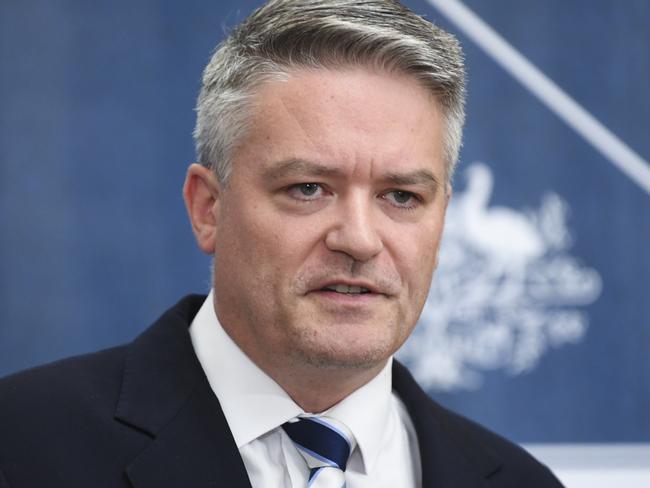 Australian Finance Minister Mathias Cormann (right) speaks during a press conference as he hands down the Mid-Year Economic and Fiscal Outlook 2017/18. Picture: AAP