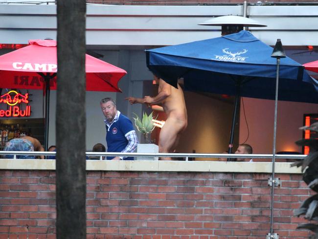 Canterbury Bulldogs players Adam Elliott strips off, while dancing to Neil Diamond, Sweet Caroline, at the Harbour View Hotel, The Rocks, during their Mad Monday celebrations. Picture: Justin Lloyd