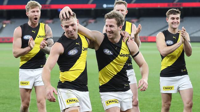 Kane Lambert, after playing his 100th game, and debutant Jake Aarts lead the team off the ground after beating Melbourne last fortnight. Picture: Michael Klein