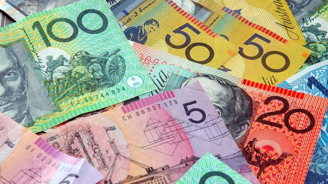 Australian notes scattered on a table. Click to see more...  Picture: istock