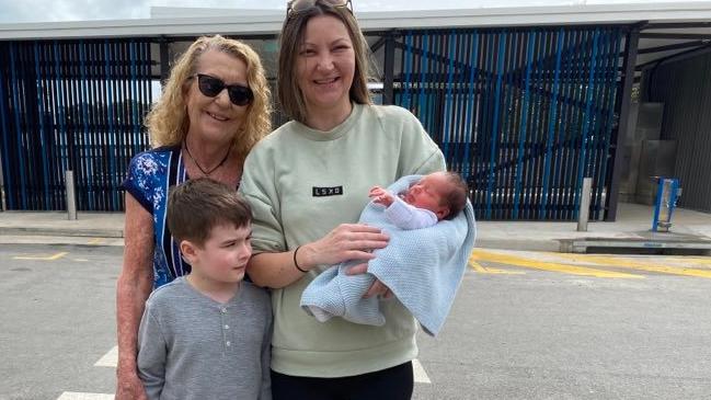 Born at the Redland Bay ferry terminal: happy family mum Emma Jones holds her newborn Phoenix Jones with her mum Rhonda and her six-year-old son Kalais. Picture: Contributed