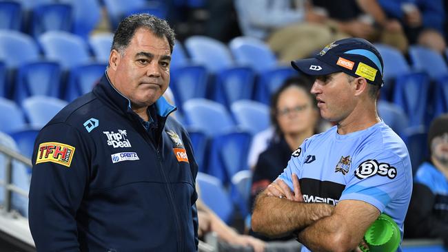 Titans Mal Meninga (left) and interim coach Luke Burt at the Broncos game. Picture: AAP.