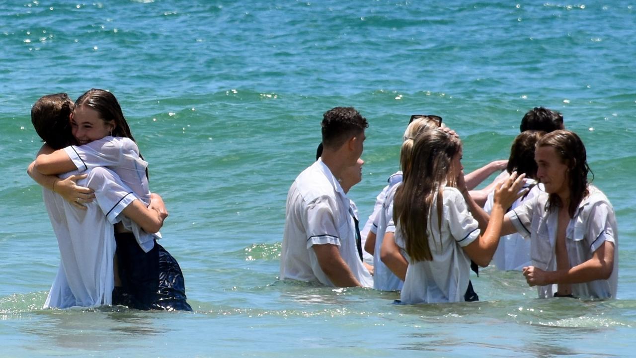 Year 12 graduates from schools across the Sunshine Coast hit to the water at Mooloolaba Beach to celebrate the end of their schooling. Photo: Mark Furler