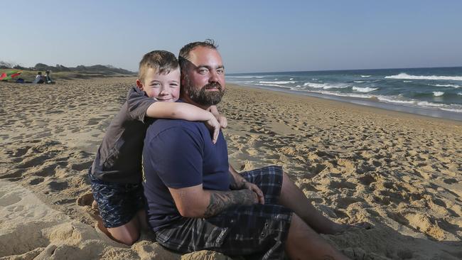 "DO NOT USE - ON HOLD FOR PRIDE OF AUSTRALIA LAUNCH" - Julian Hohnen 7yrs and his dad Maike. The two & a friend were forced to tread water for 6hrs until they were rescued, 15km off Caloundra after their boat sank earlier this year. Julian is nominated for Pride, he showed great courage and barvery for a little guy and kept his dad and friend calm during the ordeal.  Pic Mark Cranitch.