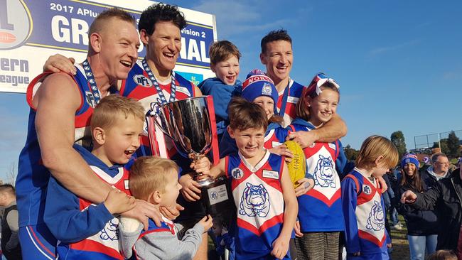 Blair and cousins Shane and Brent Harvey celebrate North Heidelberg's 2017 premiership. Picture: Tim Michell.