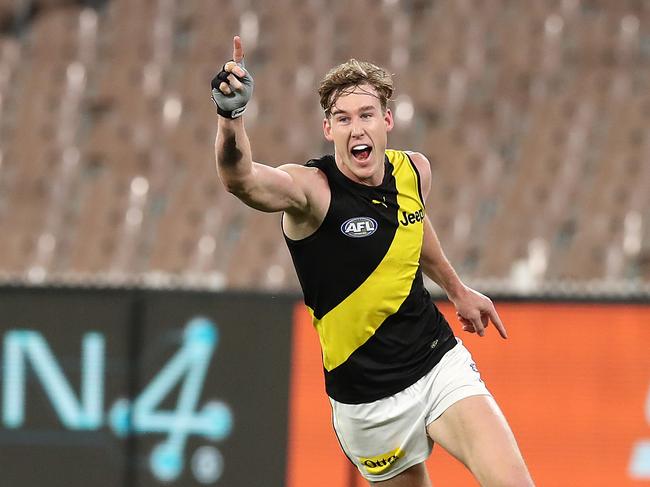 Richmond’s Tom Lynch celebrates kicking one of his three goals against Melbourne. Picture: Graham Denholm/AFL Photos via Getty Images