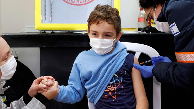 A young boy receives a dose of the Pfizer vaccine in Israel. Picture: AFP