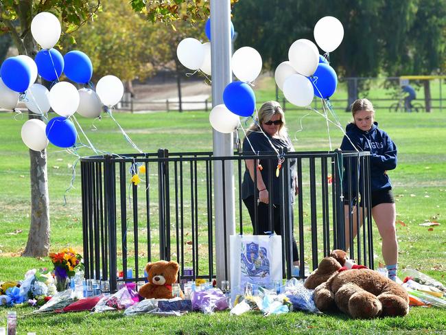 People visit a makeshift memorial at Central Park in Santa Clarita, California, after the Saugus High school shooting. Picture: AFP