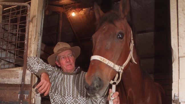 Former Melbourne Cup winer "Just A Dash" with Flemington clerk of course John Patterson at his stables in 1997. Picture: Herald Sun File